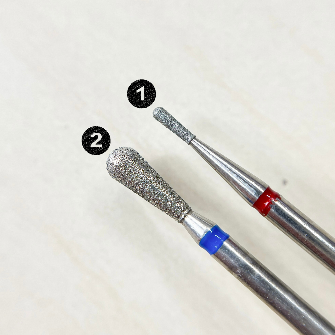 Pear-shaped nail grinding head for enlarging small pockets and treating calluses